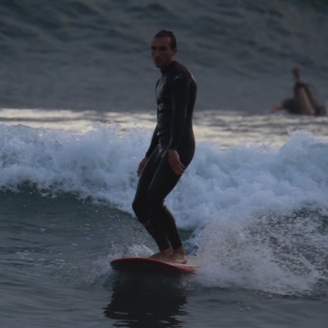 Brandon Cavalier surfing