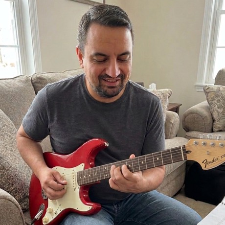 Daniel Da Silva playing guitar