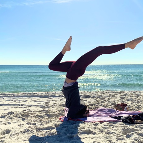 Jessica Cavalier doing yoga at the beach