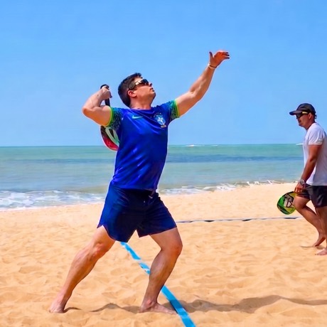 Luiz Gama playing beach tennis